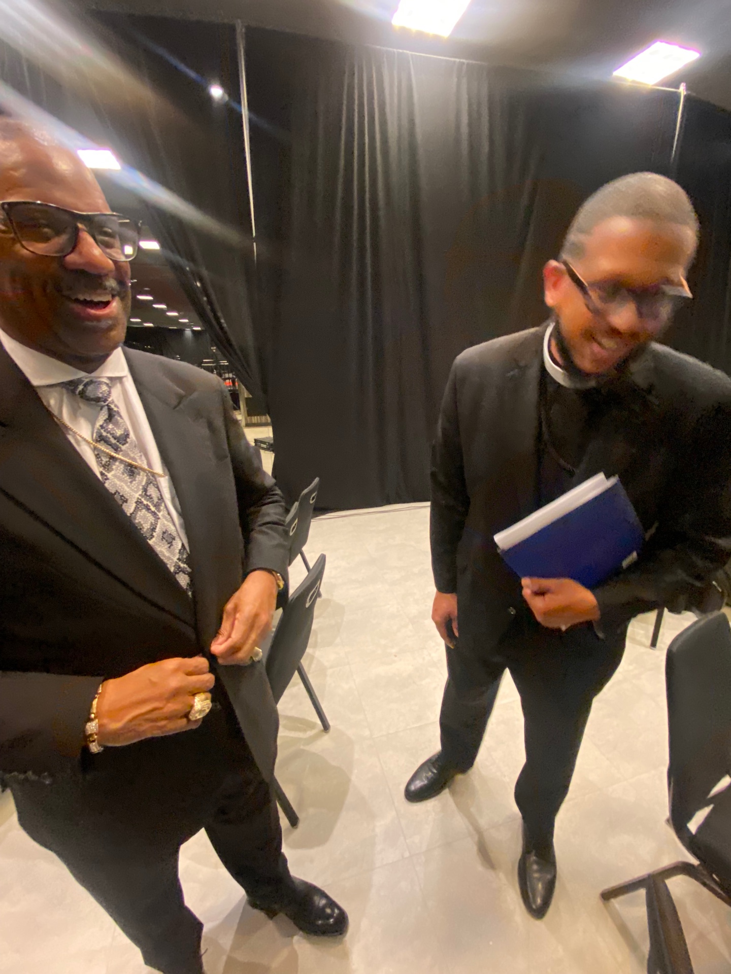 Fellowship and laughter between ministers after service