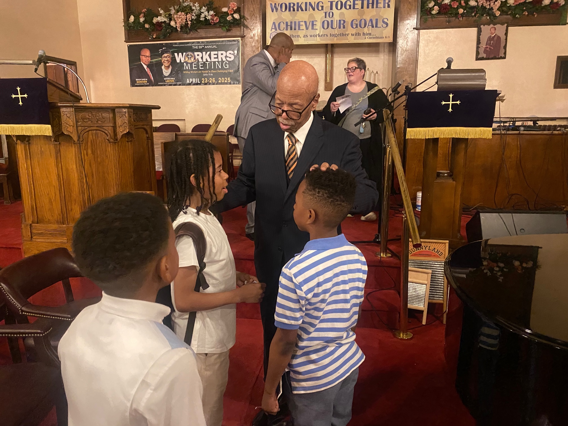Bishop encouraging young men after Sunday service