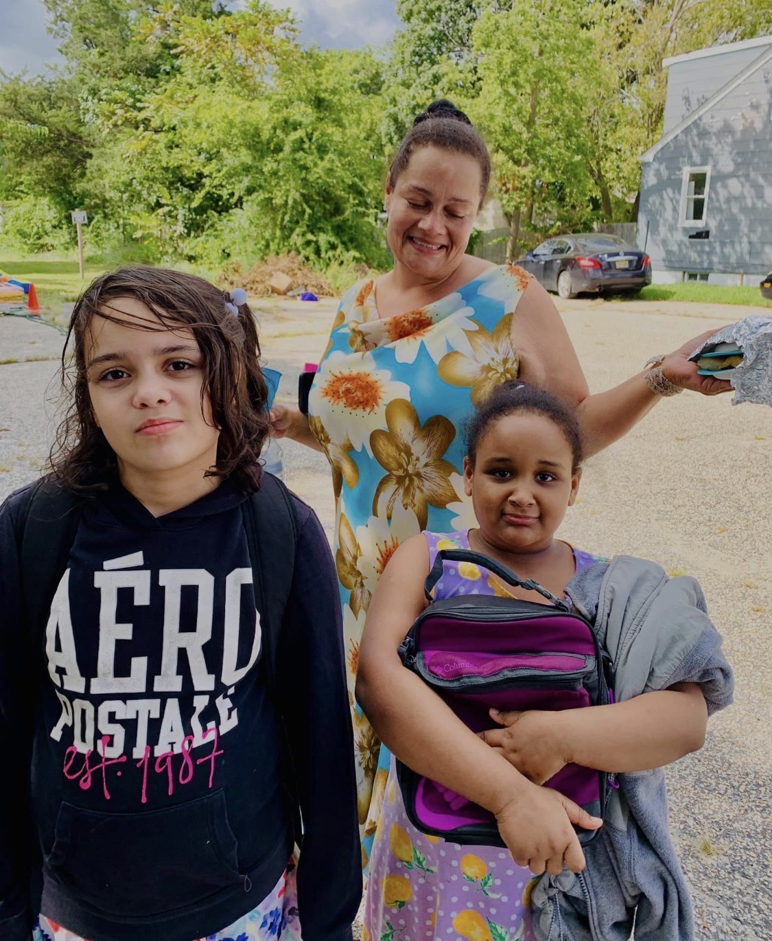 Family gathered together at a summer community event